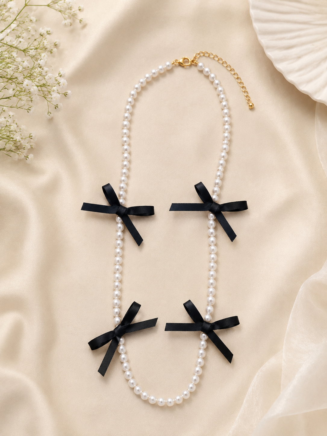 Elegant Pearl Necklace with Black Bow Charms for Women