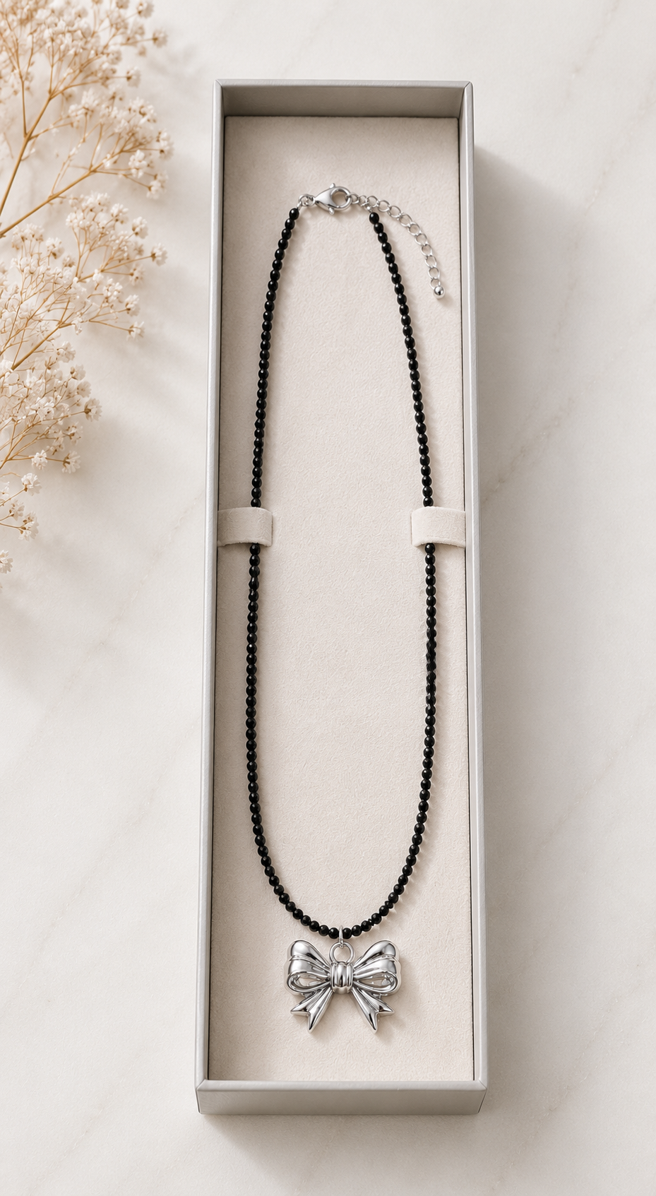 Black Beaded Necklace with Silver Bow Pendant