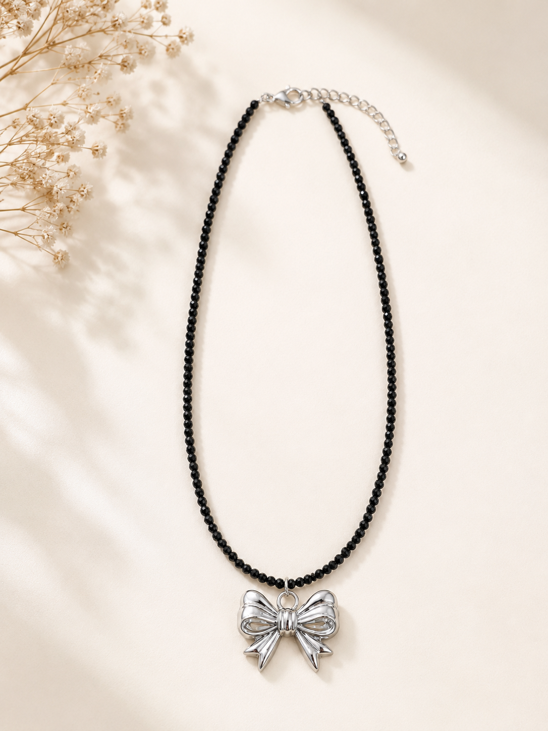 Black Beaded Necklace with Silver Bow Pendant